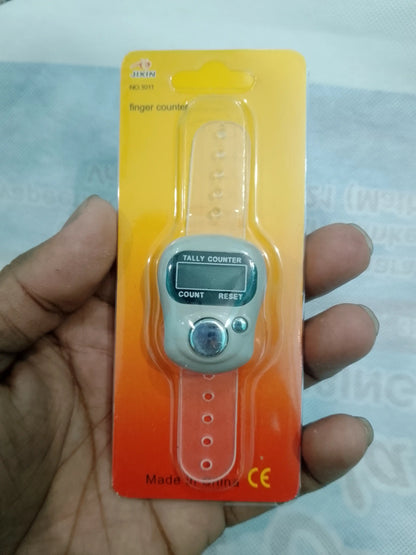 Digital finger counter on a hand with a blurred background