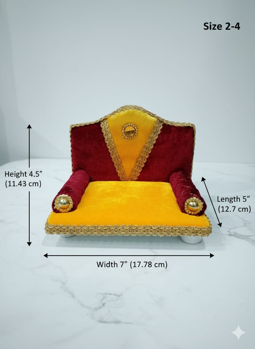 Singhasan for Gopal ji with red and yellow cushions on a white surface with teal background