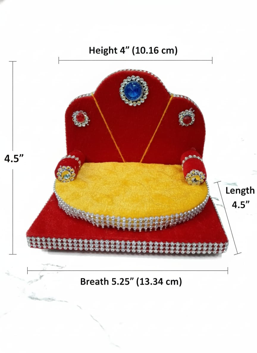 Singhasan for Gopal ji with red and yellow cushions on a white surface with teal background